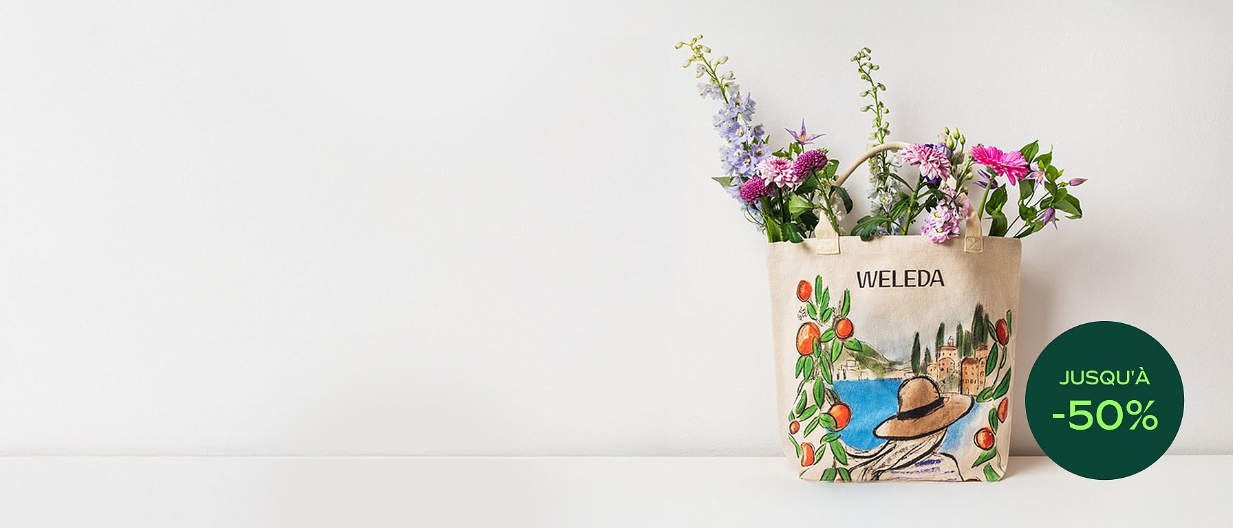 Sac de plage au design maritime avec inscription Weleda, rempli de fleurs