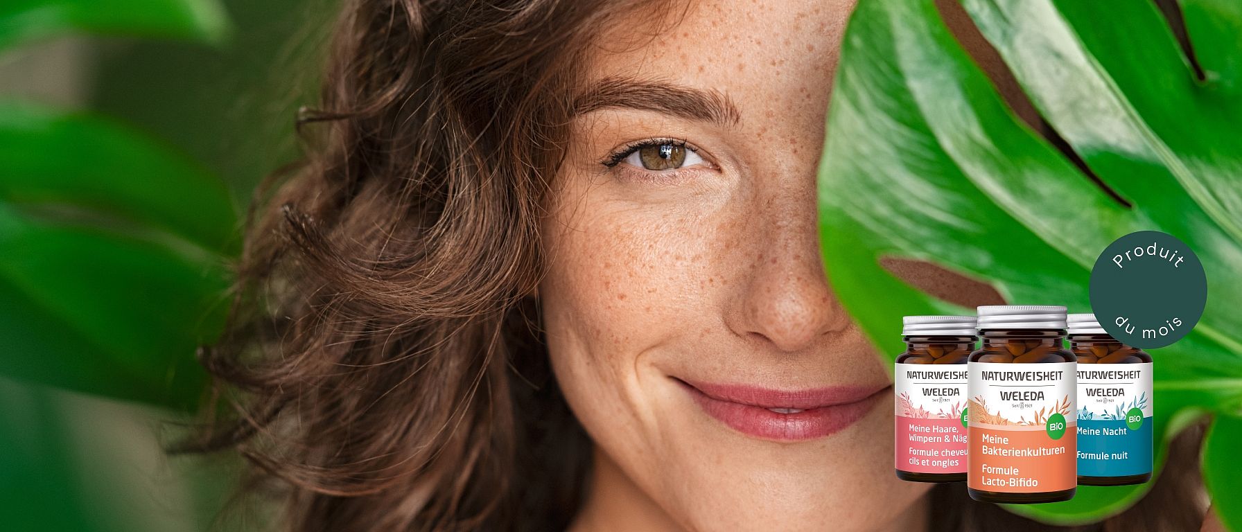 Femme derrière une feuille avec image des compléments alimentaires Weleda